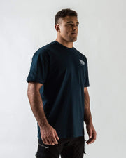 Kingz Immersion Tee Navy - Three-Quarter View Male Athlete Minimalist Design Small White Text Left Chest Relaxed Fit Short Sleeve Streetwear [color:Navy]